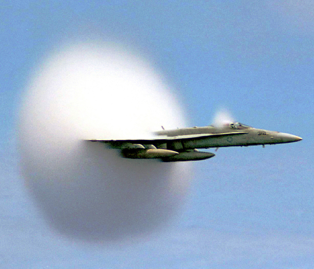 As a work of the U.S. federal government, this image is in the public domain. Rapid condensation of water vapor due to a sonic shock produced at sub-sonic speed creates a vapor cone (known as a PrandtlGlauert singularity), which can be seen with the naked eye